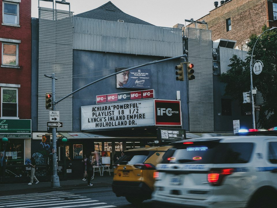 Movie theatre marquee on a city street corner