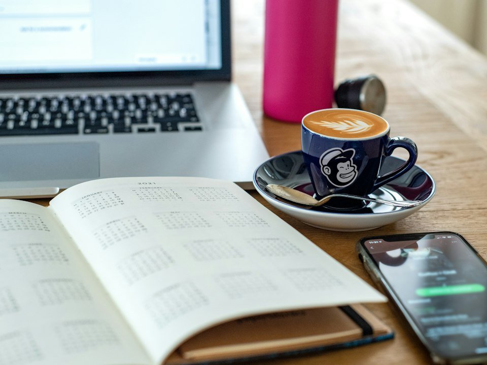 Coffee cup and pen on a desk