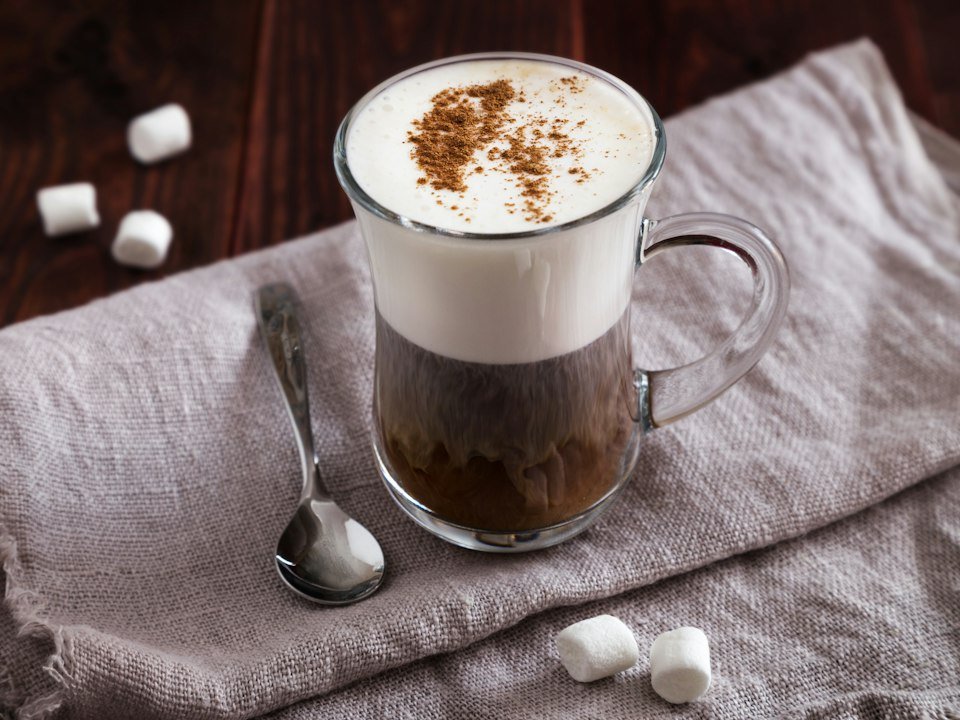 Hot chocolate topped with marshmallows on a napkin
