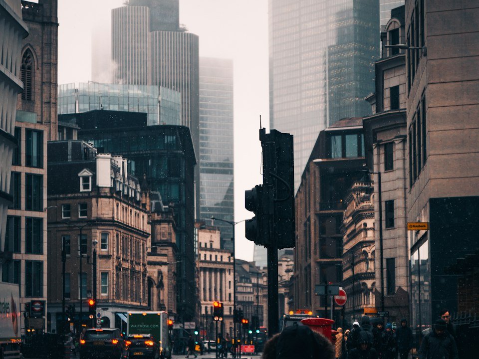 Person walking down a rainy London street